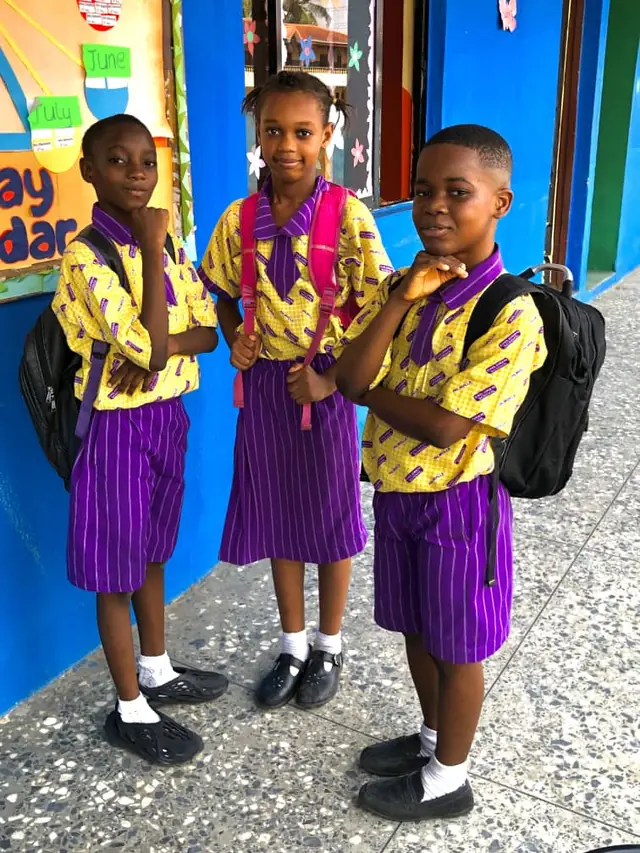 Palmville Children School pupils in uniform with school bags