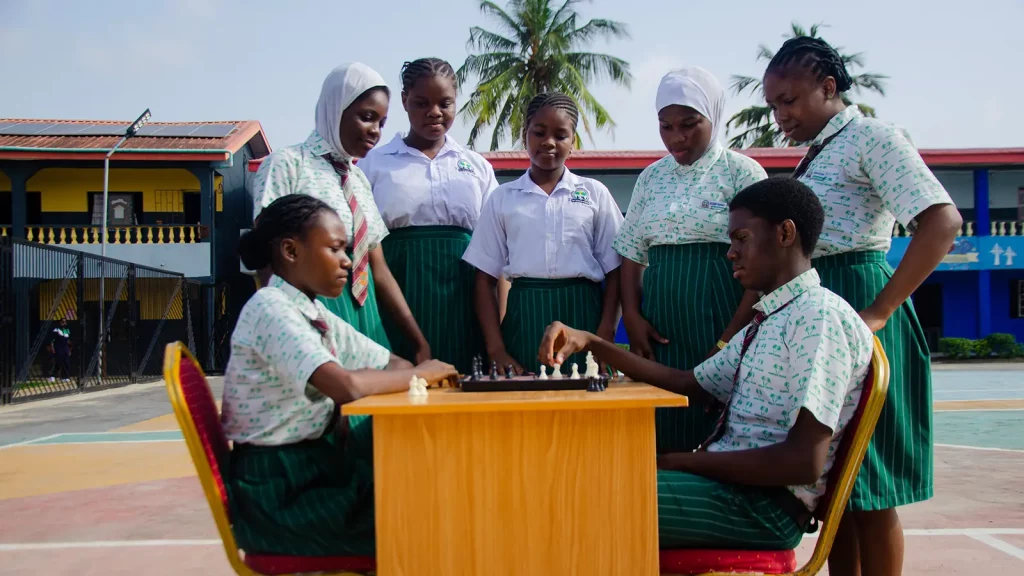 Palmville students playing chess at the school chess club