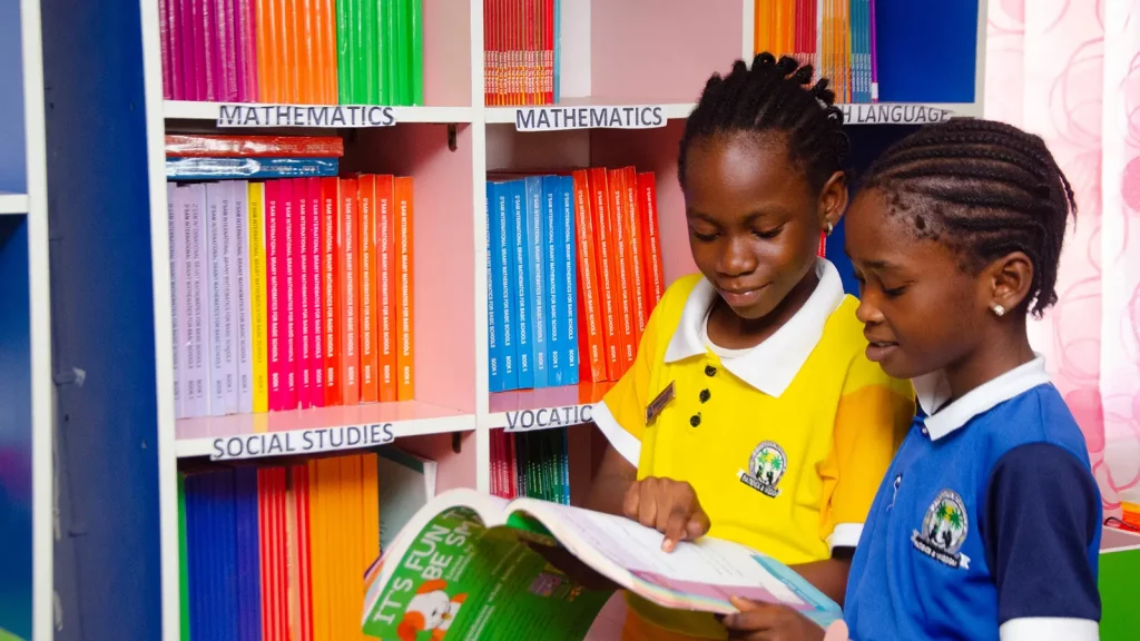 Primary school pupils reading in the Palmville Children School library