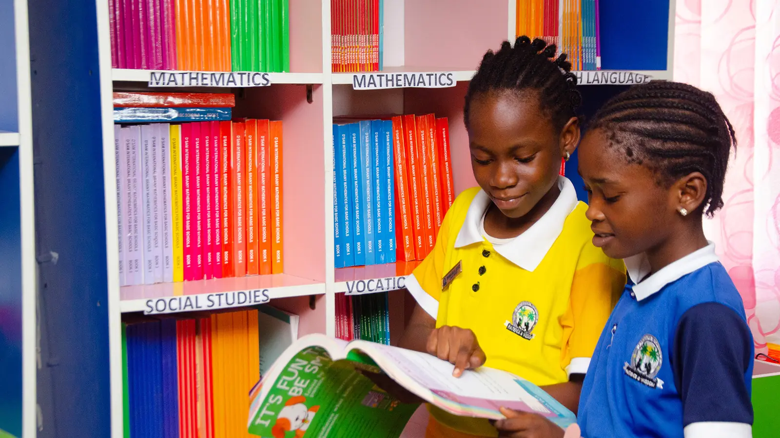 Primary school pupils reading in the Palmville Children School library